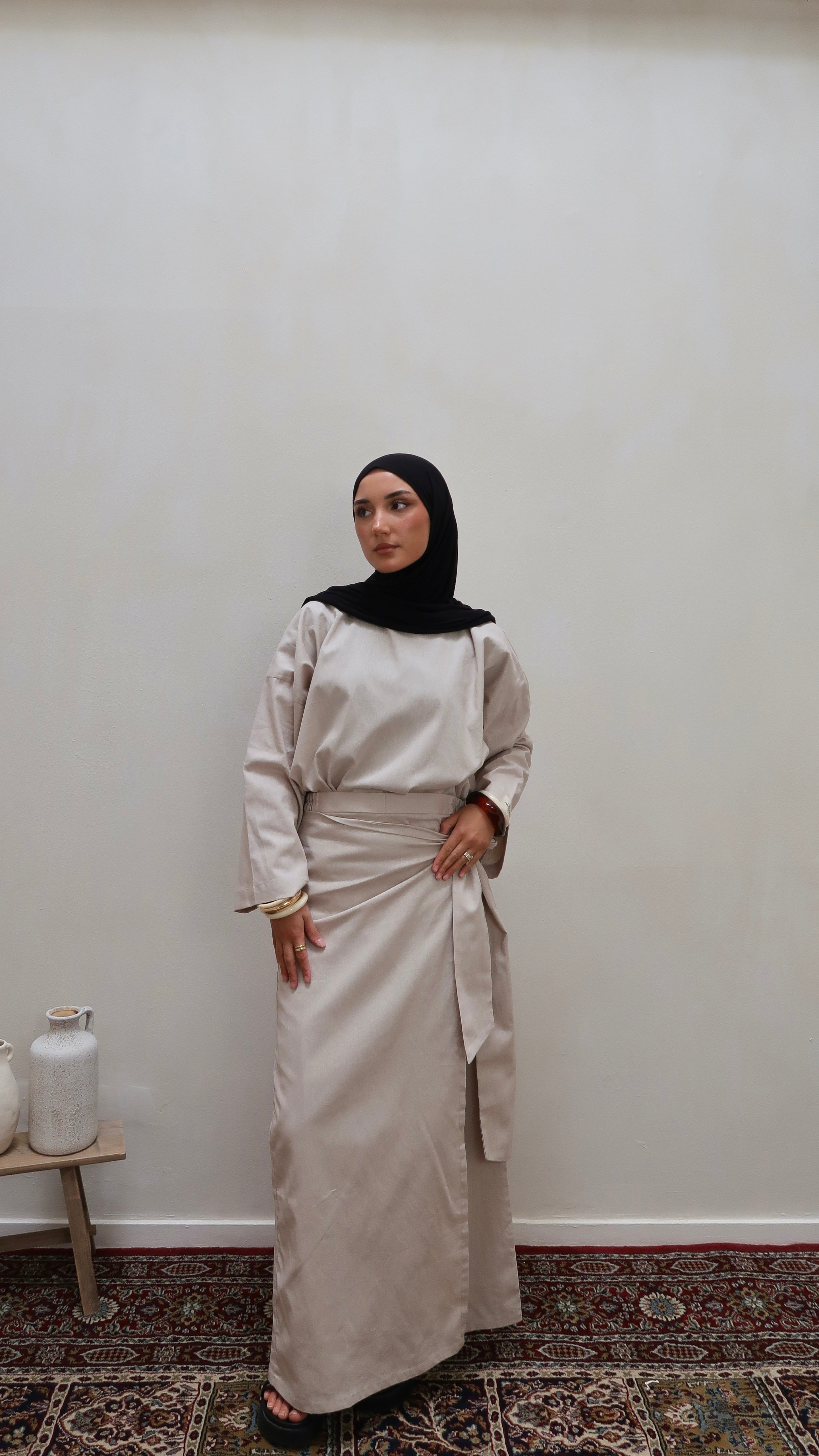 Two-piece with wrap skirt sand