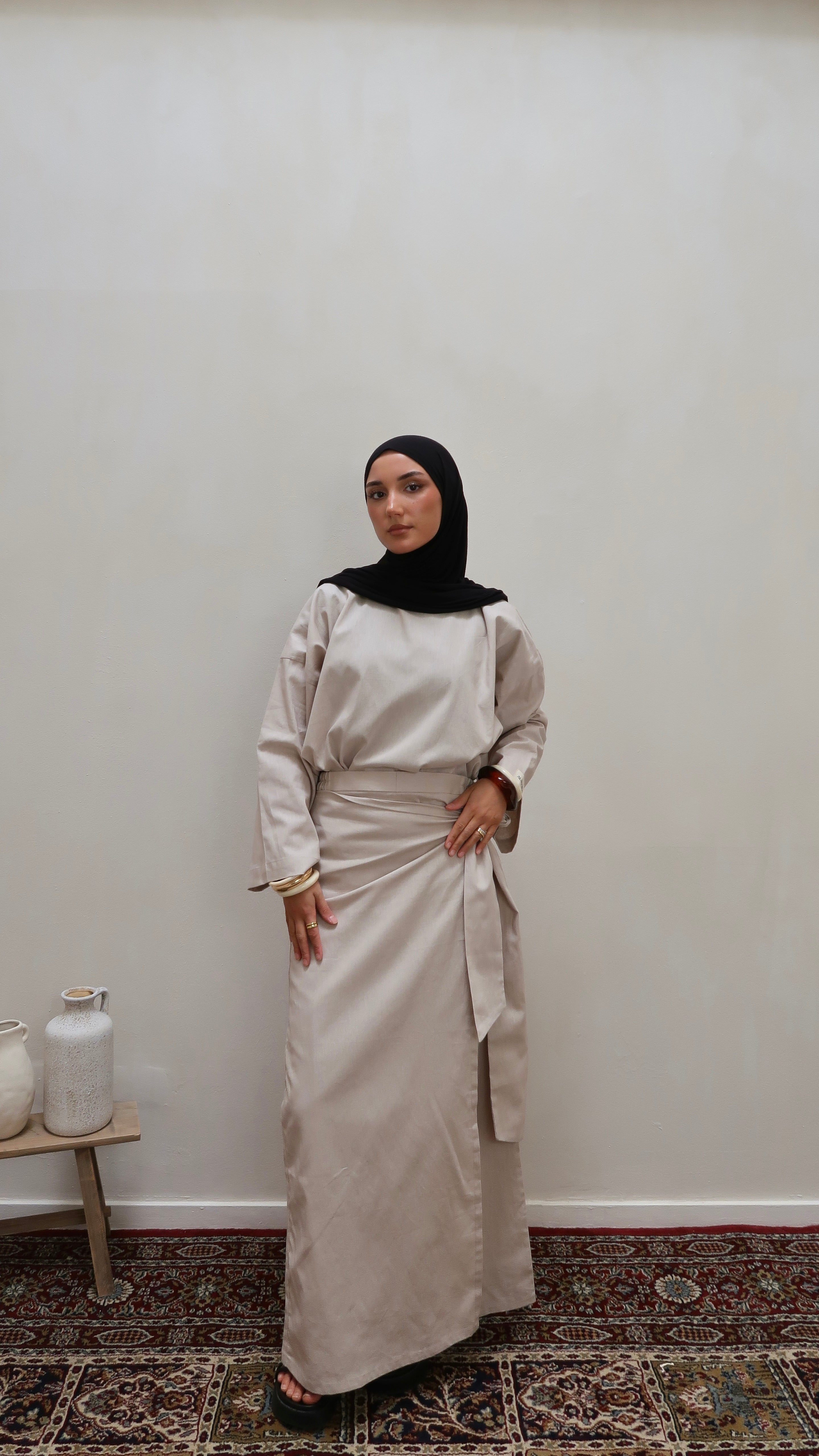 Two-piece with wrap skirt sand