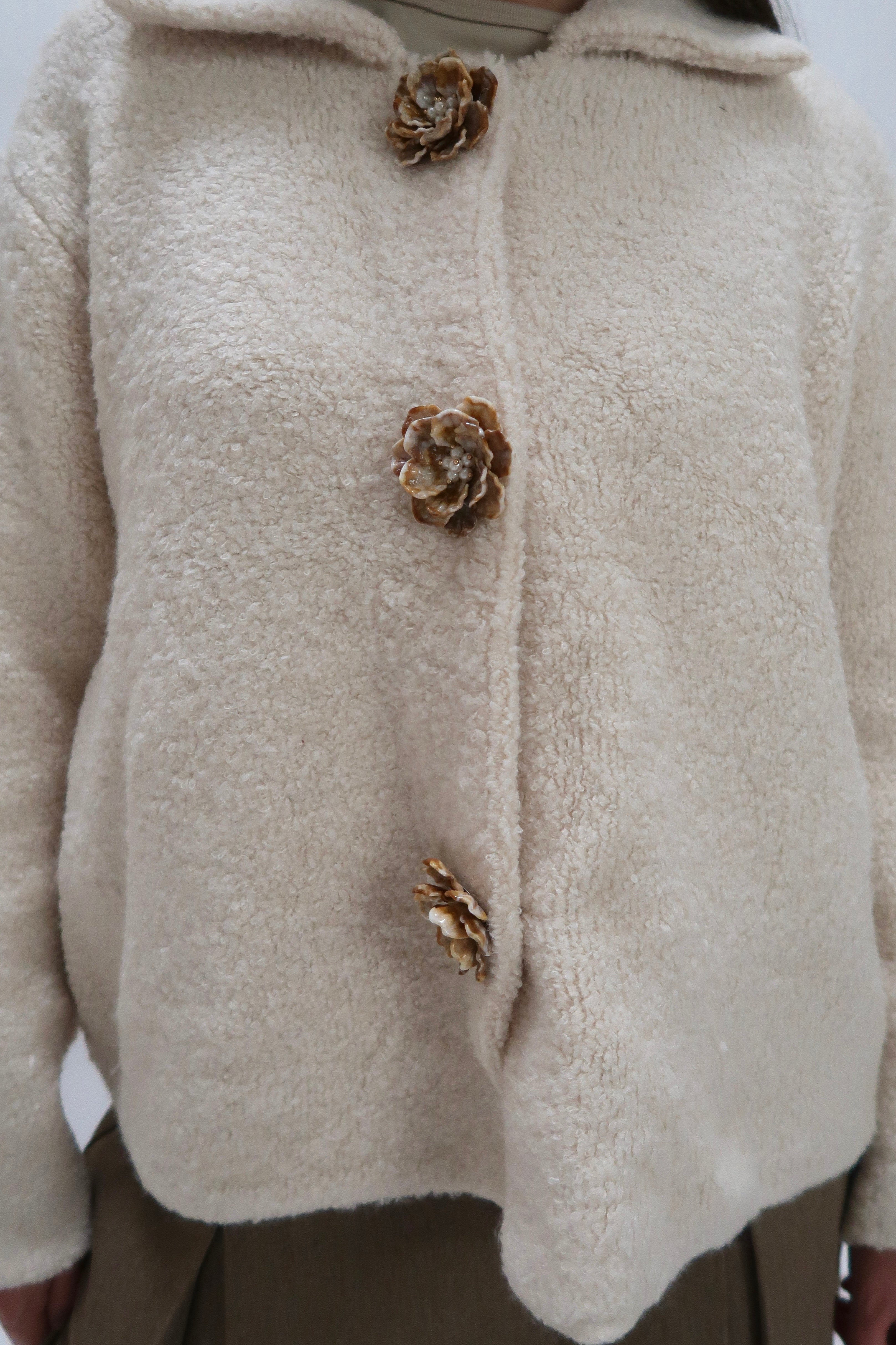 Transitional jacket with flower buttons